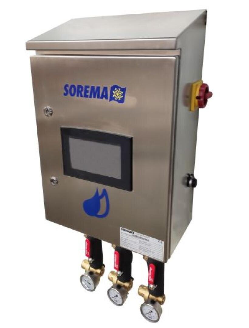 A stainless steel control panel by SOREMA with a touchscreen display, emergency stop button, and three connected pressure gauges with red valves at the bottom.