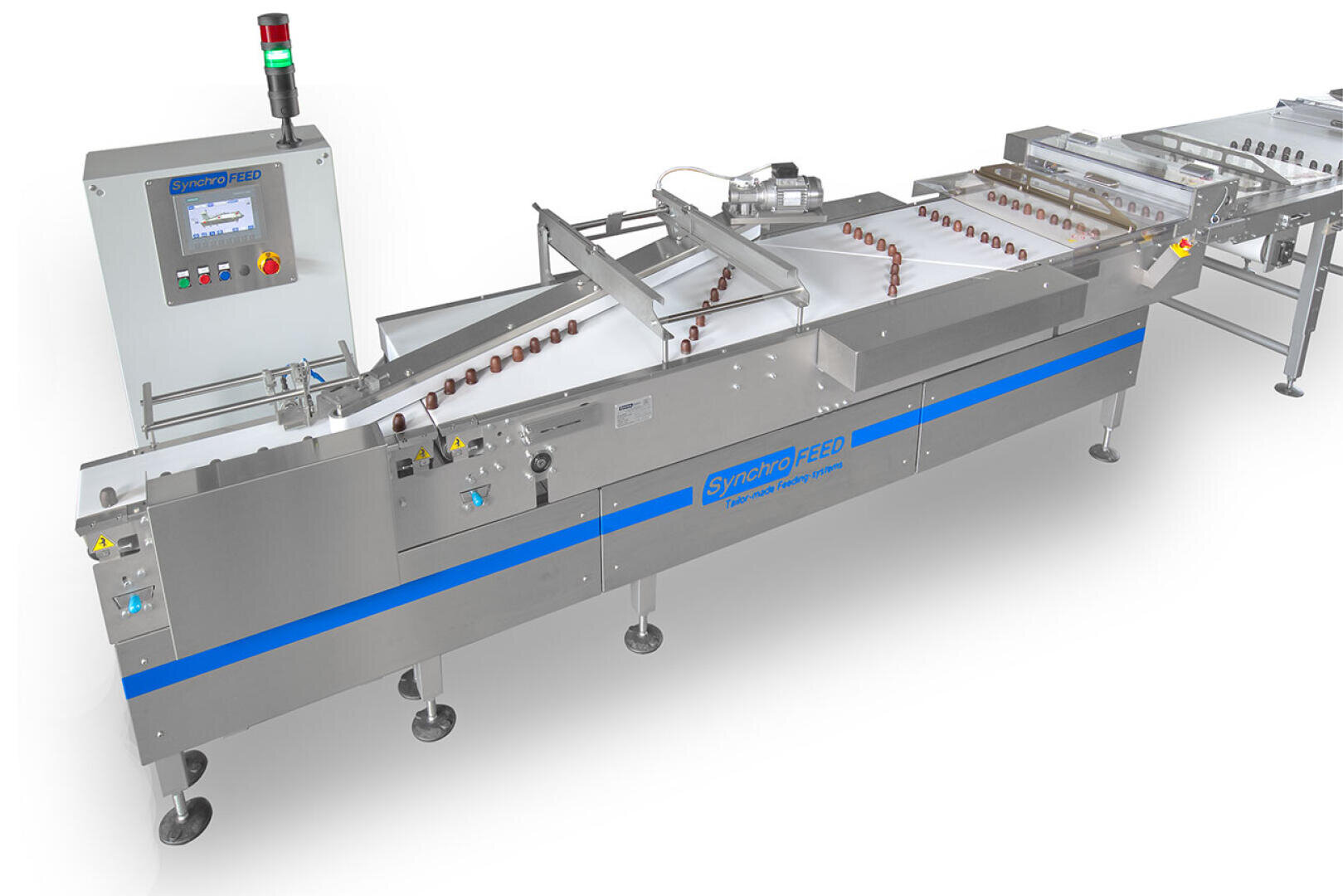 A stainless steel industrial conveyor system with a control panel, sorting small round objects on white conveyor belts. The machine has blue accents and labeled SynchroFEED.