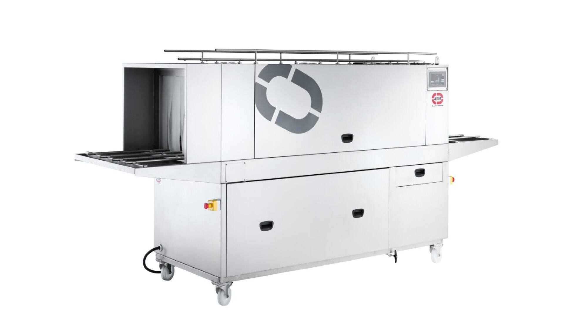 A large industrial stainless steel machine with wheels, a conveyor belt, control panel, and safety switches, designed for automated washing or processing in a commercial setting.