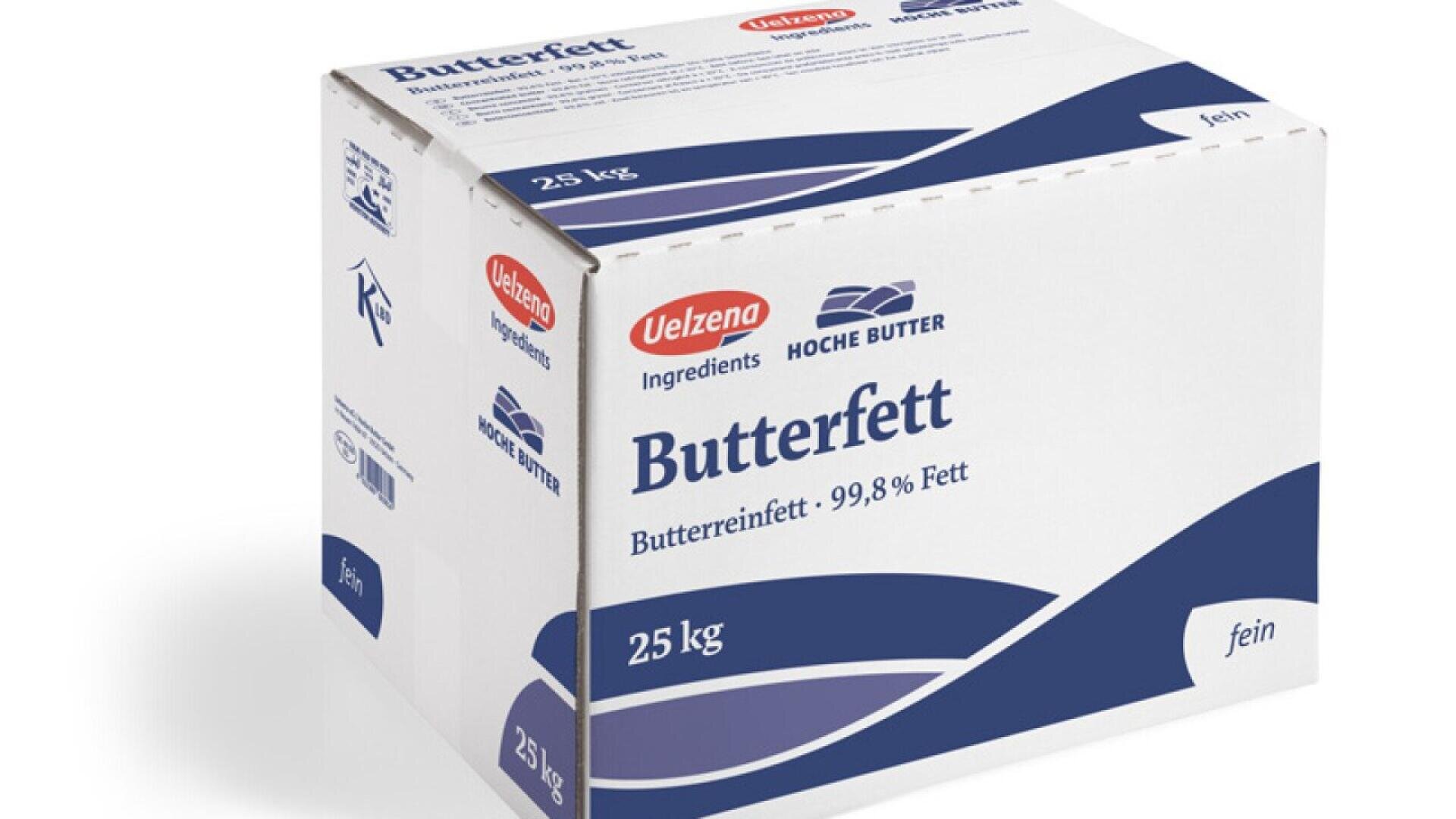 A white and blue 25 kg box of Velzena Butterfett, labeled as 99.8% pure butterfat, featuring product information and branding in German.