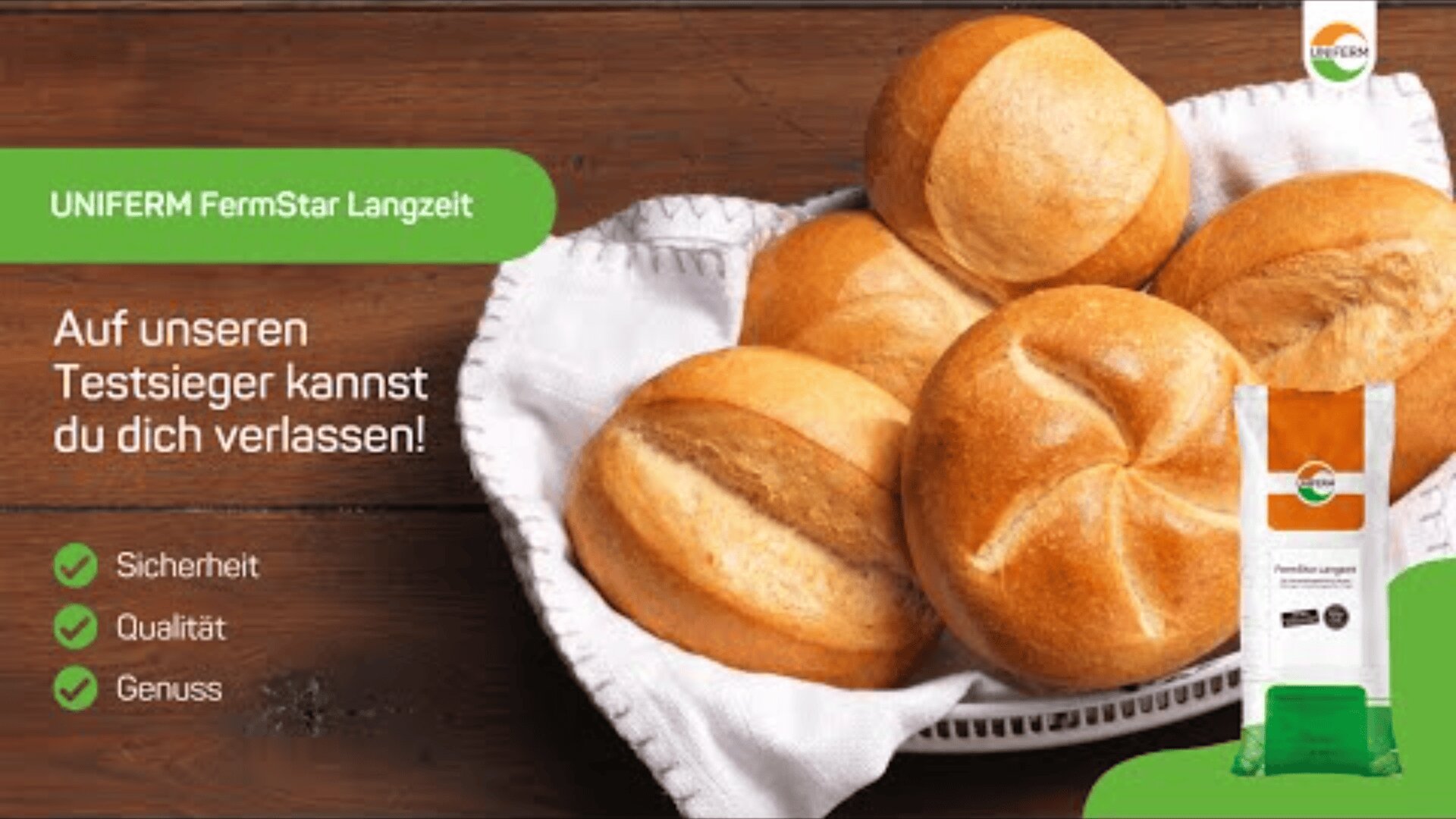 A white basket filled with five round, golden-brown bread rolls sits on a wooden surface. Text in German and product packaging for UNIFERM FermStar Langzeit appear alongside checkmarks for safety, quality, and enjoyment.