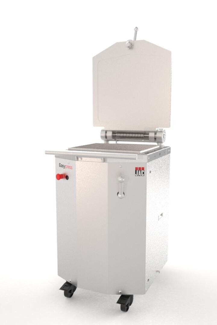 A commercial bread slicer machine with a metallic body, a large rectangular cutting area, a red lever, and the JAC brand logo. The top lid is open and the machine is on four small wheels.