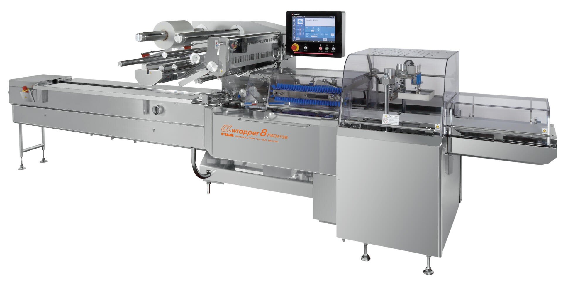 A large, industrial food packaging machine with a conveyor belt, control panel, and various rollers and compartments, designed for wrapping products in plastic film.