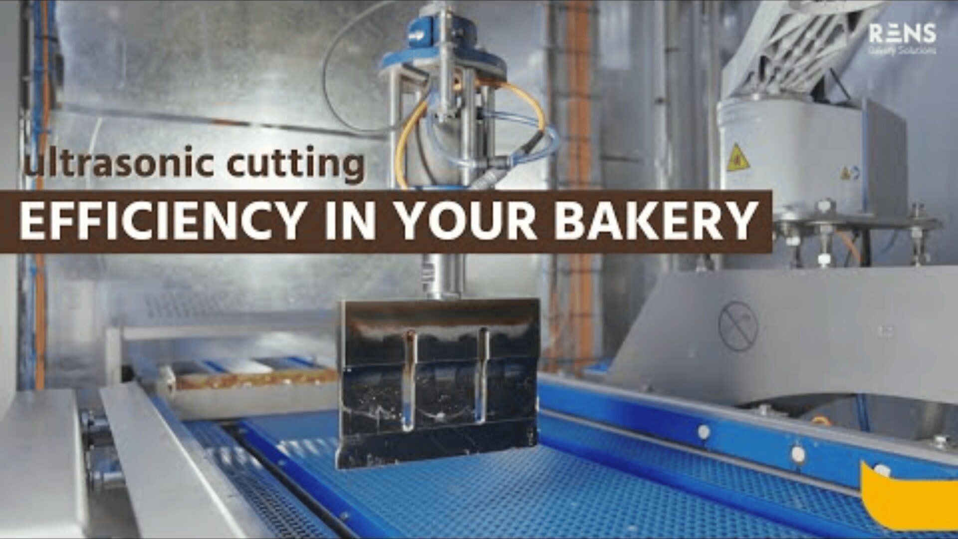 An industrial ultrasonic cutting machine operates on a blue conveyor belt in a modern bakery, with text overlay reading Ultrasonic cutting EFFICIENCY IN YOUR BAKERY.