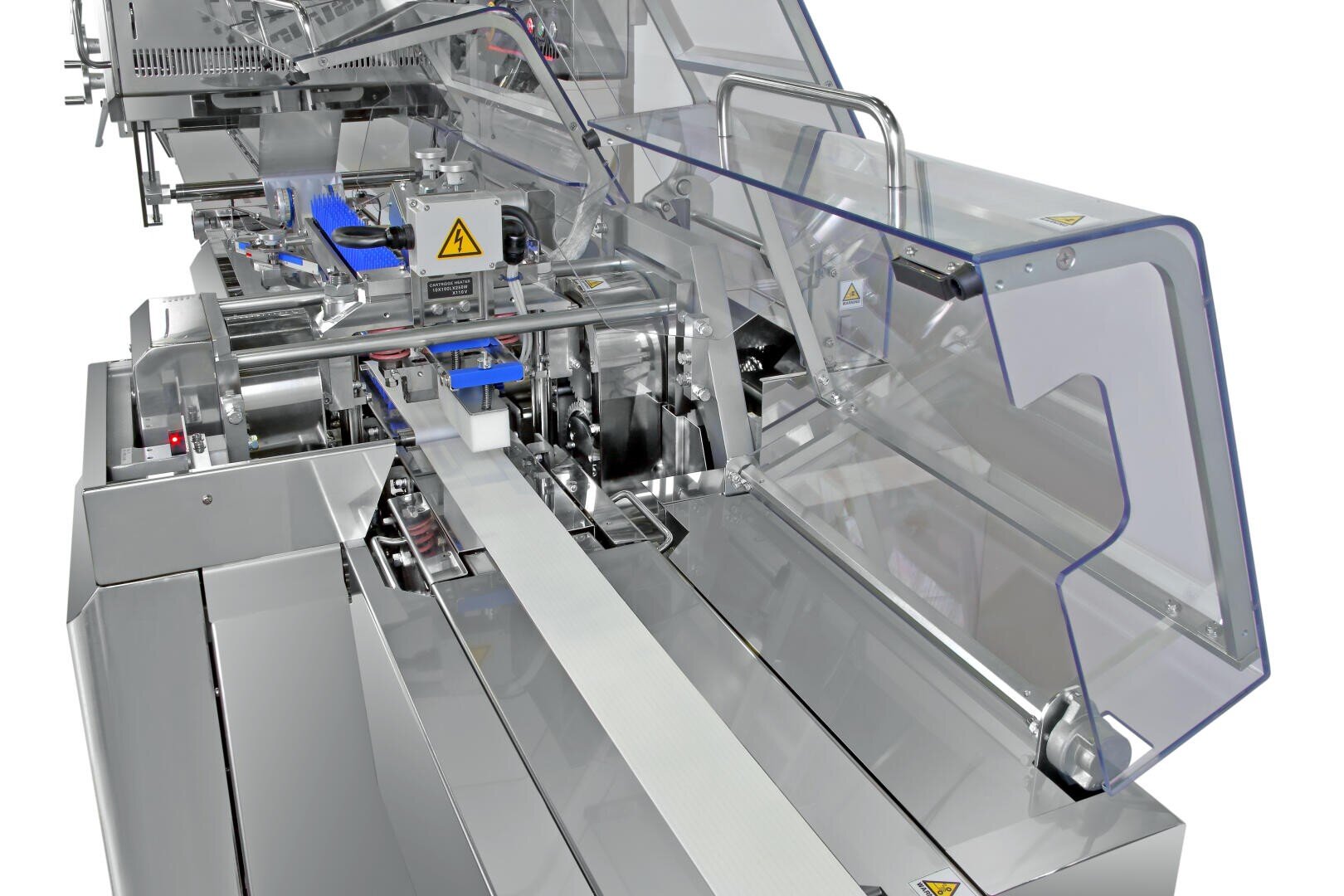 A close-up view of an industrial food processing and packaging machine made of stainless steel with blue conveyor belts and transparent protective covers.