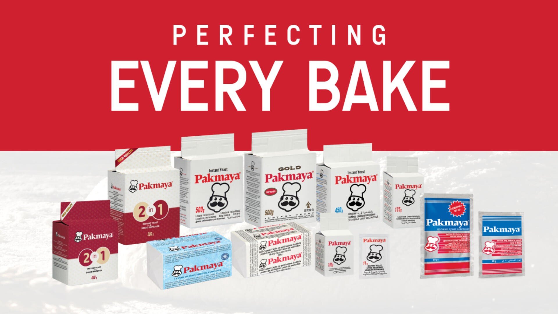 A variety of Pakmaya baking products, including yeast and baking powder, are displayed in front of a red background with the words Perfecting Every Bake in bold white text above.