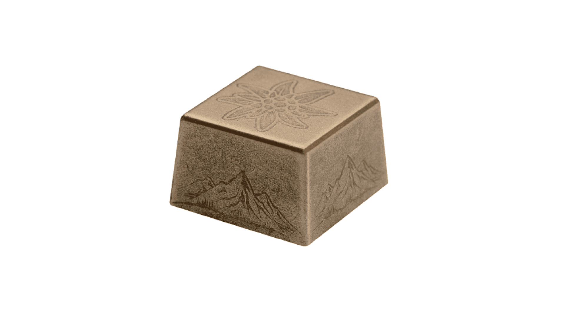 A single square of milk chocolate with an embossed flower on top and mountain designs on the sides, set against a white background.