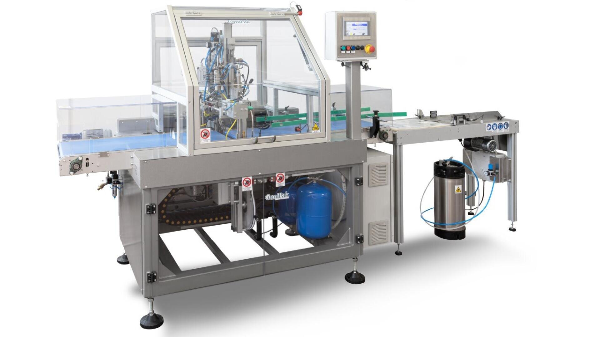 Automated industrial packaging machine with a transparent safety cover, conveyor belts, control panel with display and buttons, and visible internal components, including tanks and wiring, used for processing products.