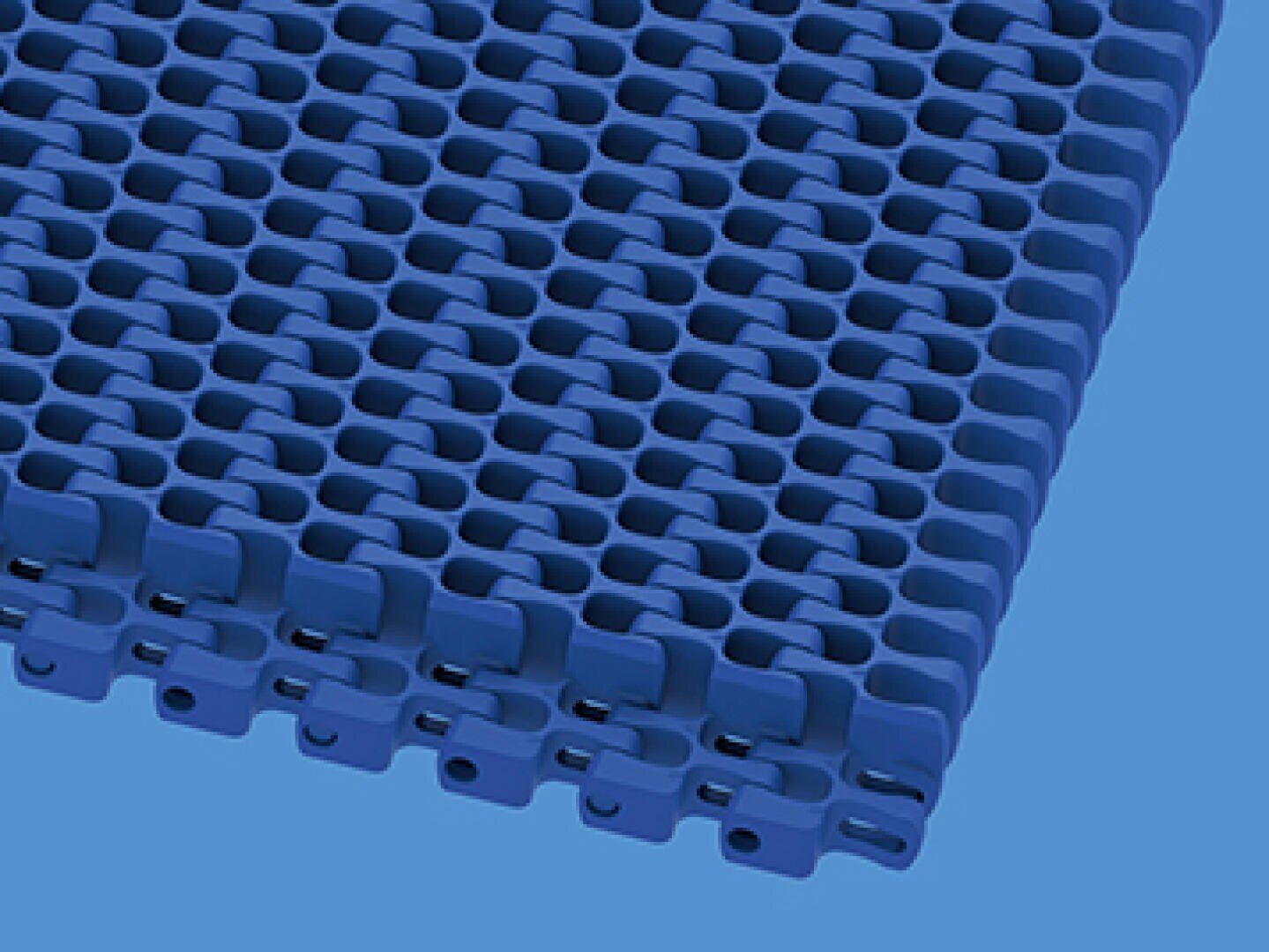 A close-up view of interlocking blue plastic modular conveyor belt segments on a light blue background.