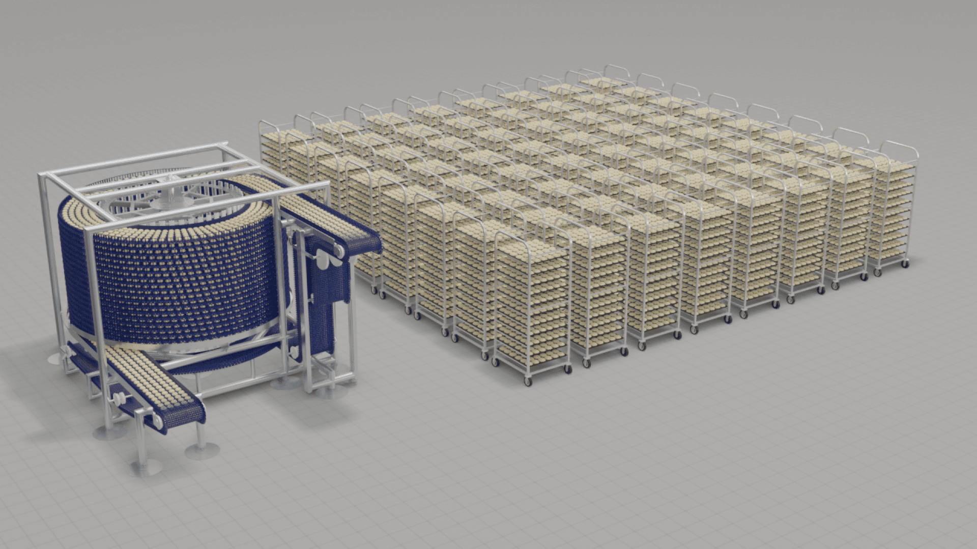 A large spiral conveyor system with a blue belt sits next to rows of stacked metal racks filled with trays, all on a gray grid-patterned floor.