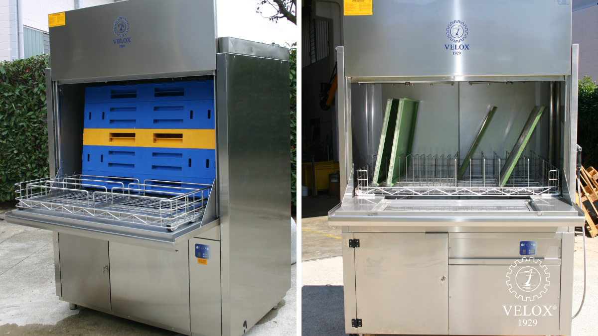 Two industrial dishwashers by VELOX with open doors, one loaded with blue and yellow trays, the other with green panels inside, both in outdoor settings. The brand logo and 1929 appear on each machine.