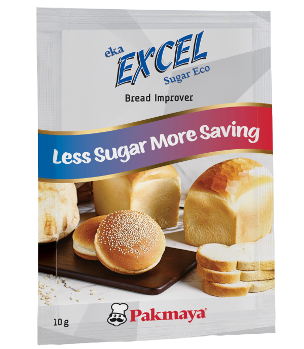A sachet labeled eka EXCEL Sugar Eco Bread Improver with the tagline Less Sugar More Saving, featuring images of loaves and slices of bread and buns. The Pakmaya logo and 10g are at the bottom.
