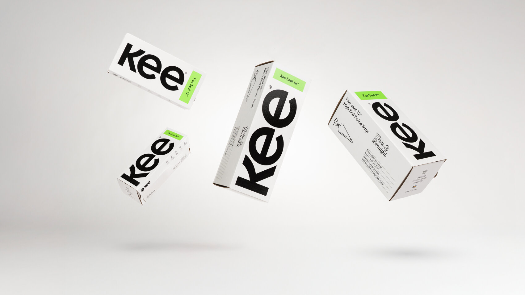 Four white boxes with bold black kee branding are suspended in mid-air against a plain white background. Each box has green labels and black text, creating a clean, modern look.